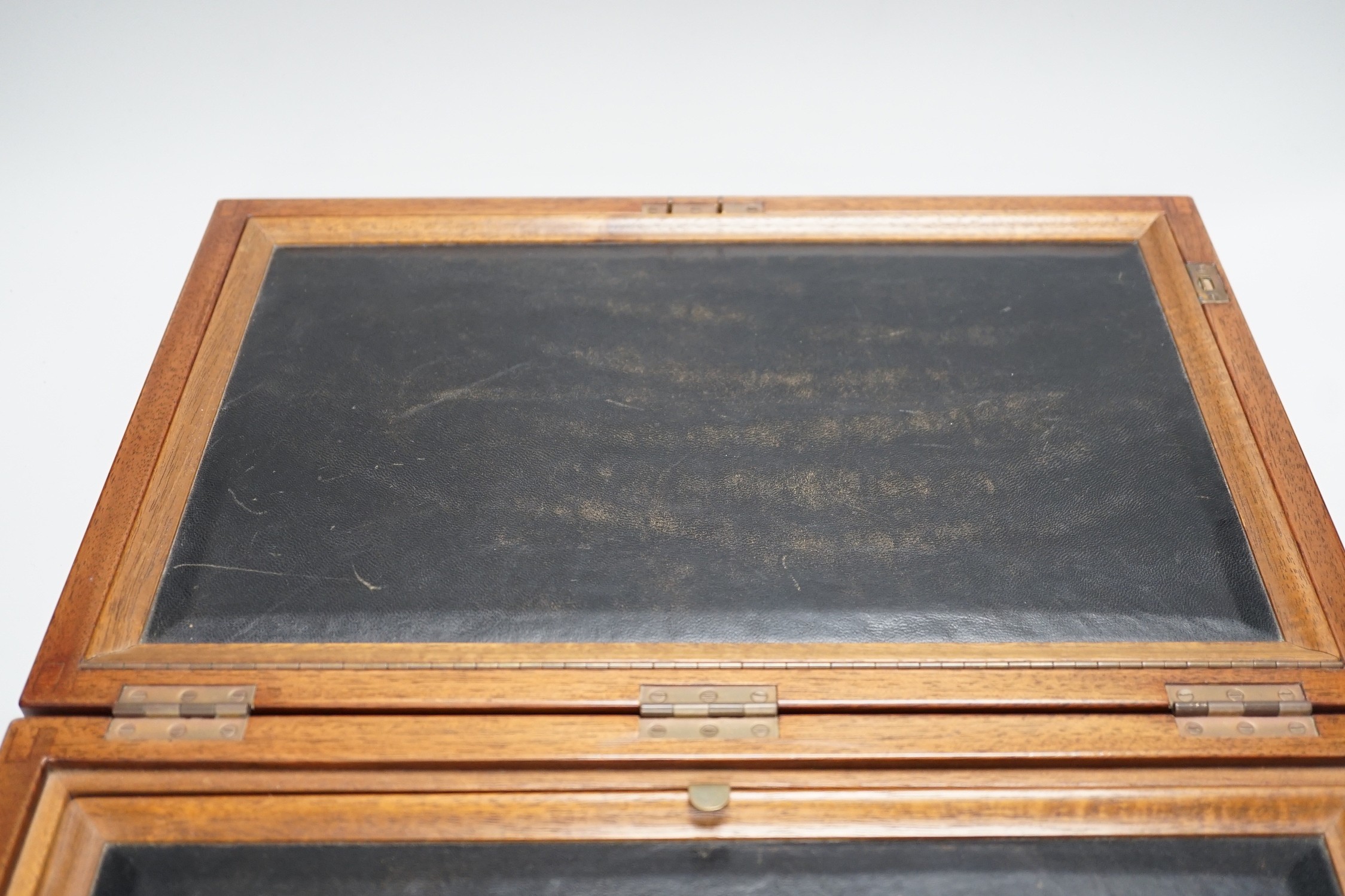 An inlaid mahogany writing slope with two silver-mounted inkwells, 39cm wide